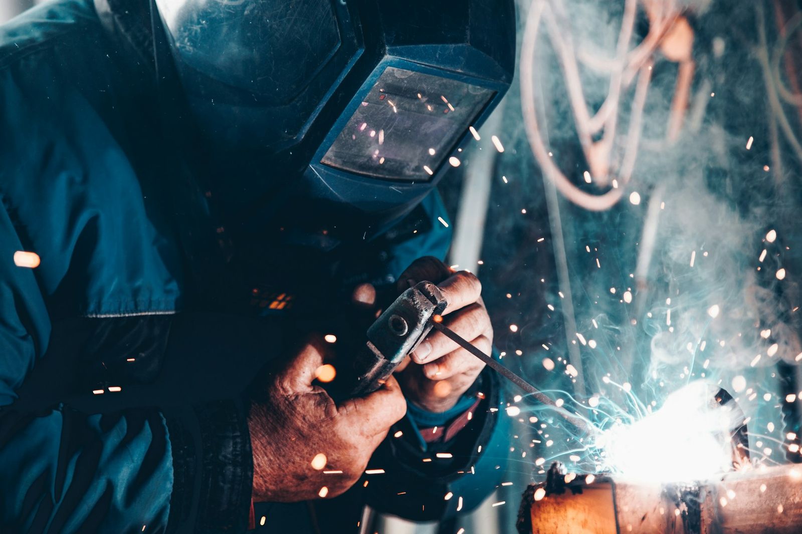 Marine engineer welding during repair work